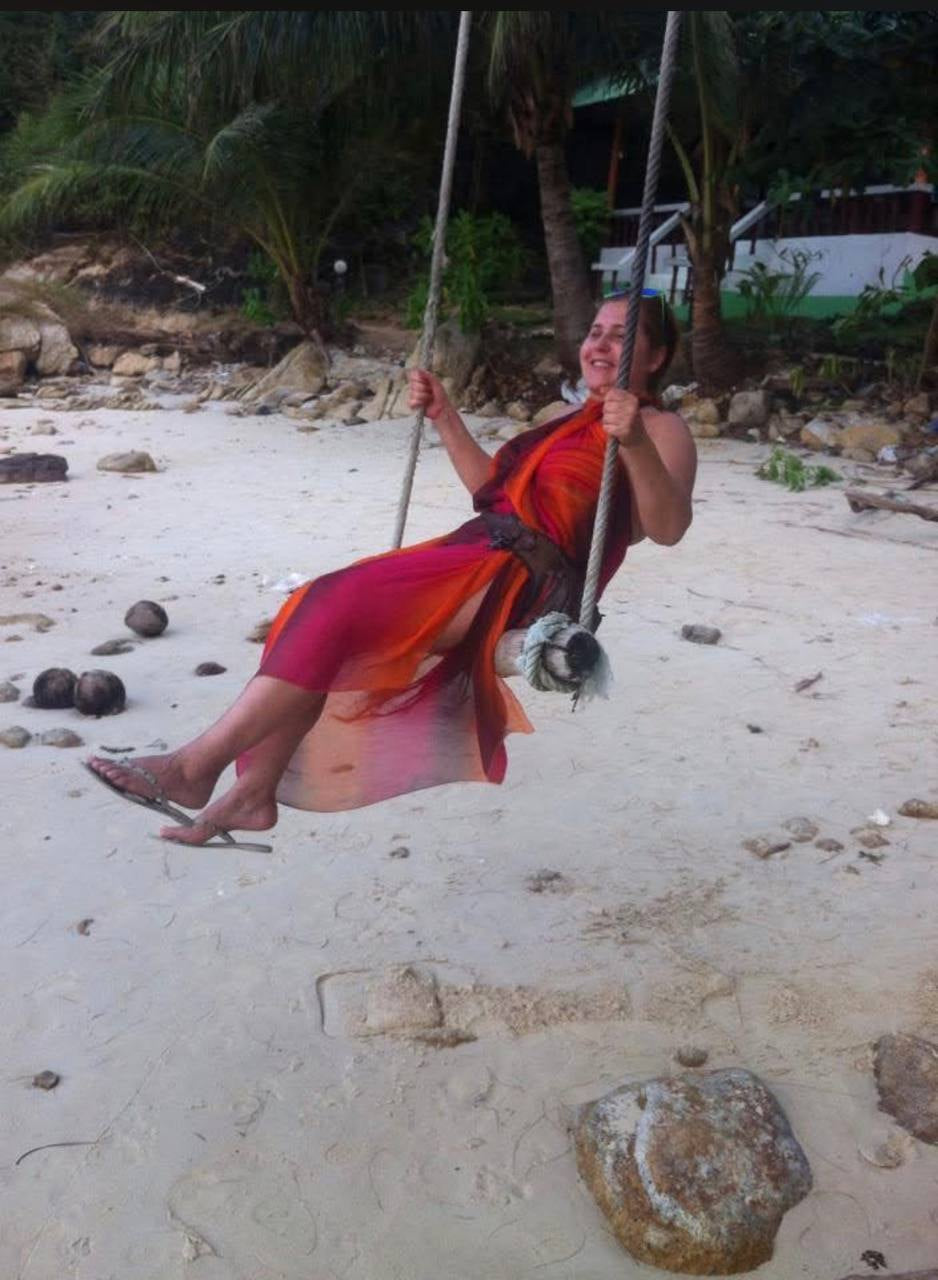 Elena, founder of Best Plan No Plan, on a swing on Koh Phangan