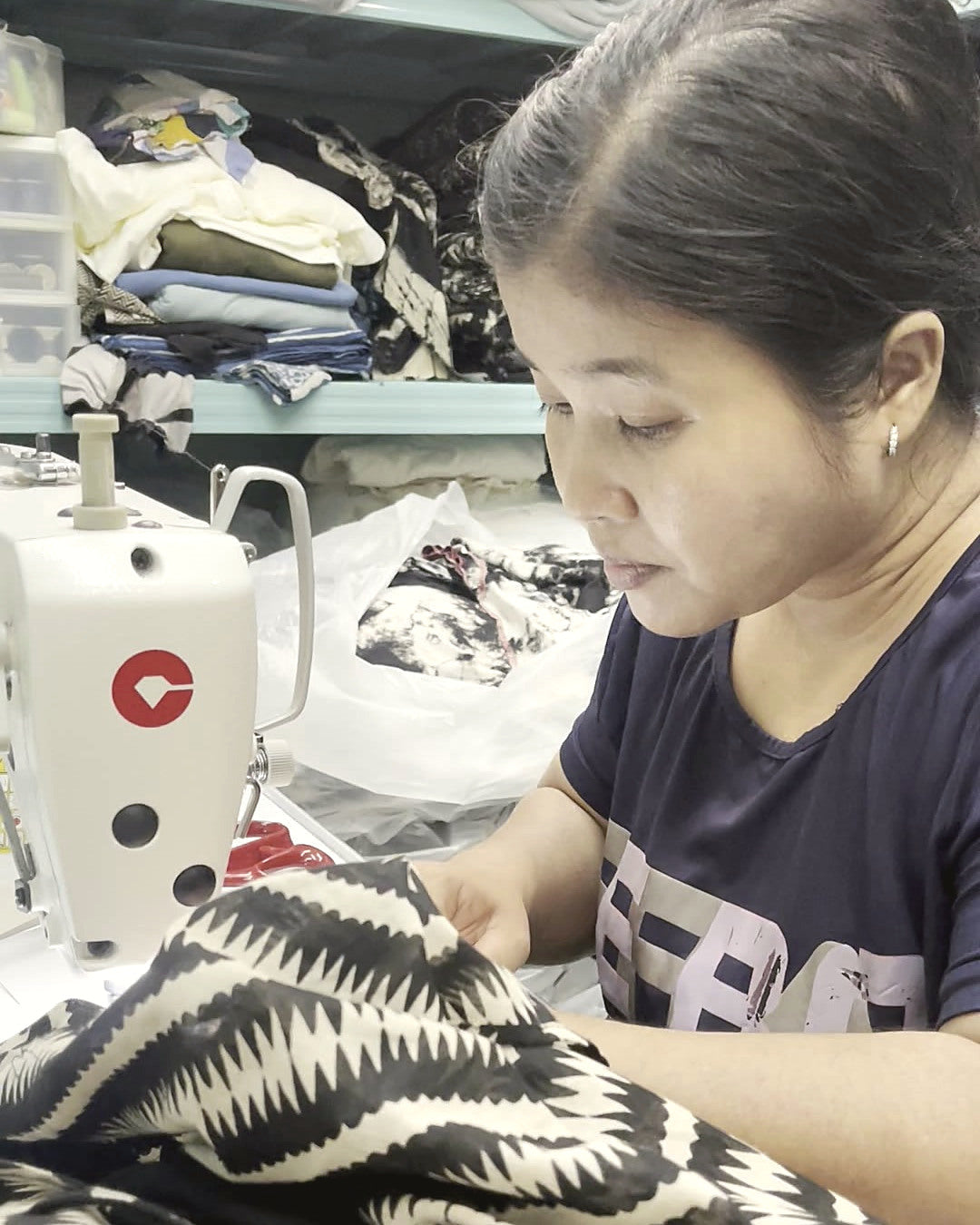 A seamstress at her machine in the Best Plan No Plan atelier, Koh Phangan